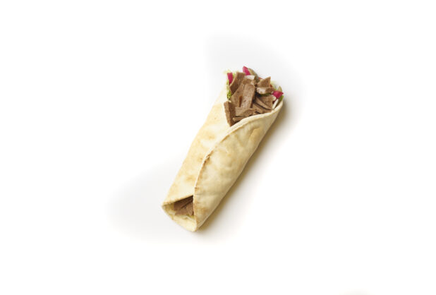 Overhead View of a Gyro Pita Wrap with Fresh Vegetable Toppings, Shot on White for Isolation