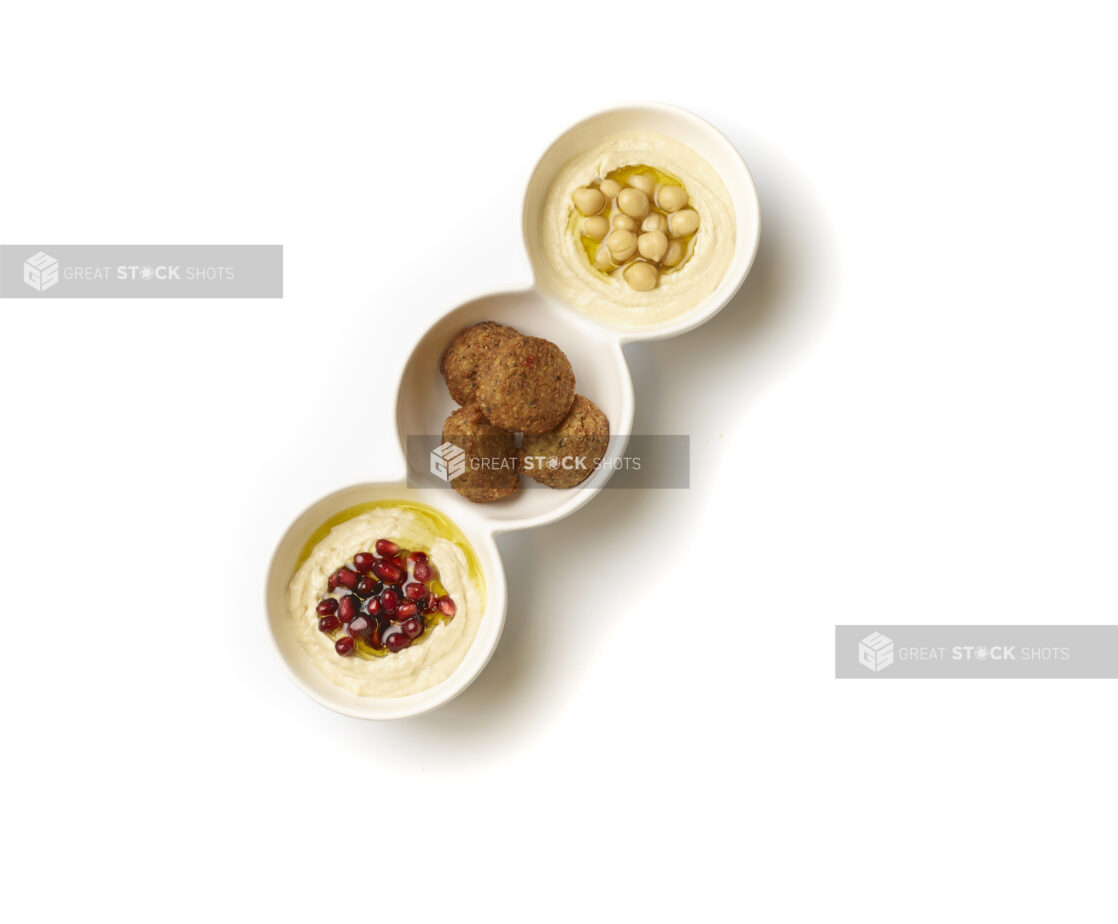 Overhead View of a Trio Plate of Side Dishes: Falafel Balls, Baba Ganoush and Hummus, on a White Background for Isolation