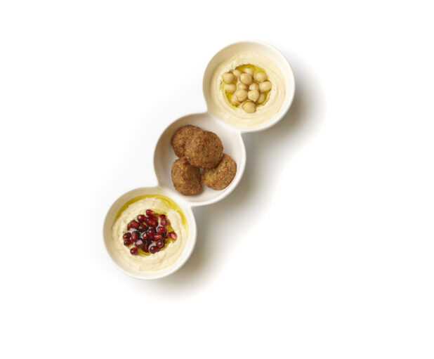 Overhead View of a Trio Plate of Side Dishes: Falafel Balls, Baba Ganoush and Hummus, on a White Background for Isolation