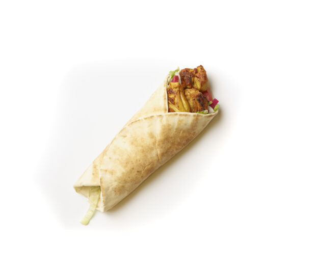 Overhead View of a Chicken Kebab Pita Wrap with Fresh Vegetable Toppings, Shot on White for Isolation