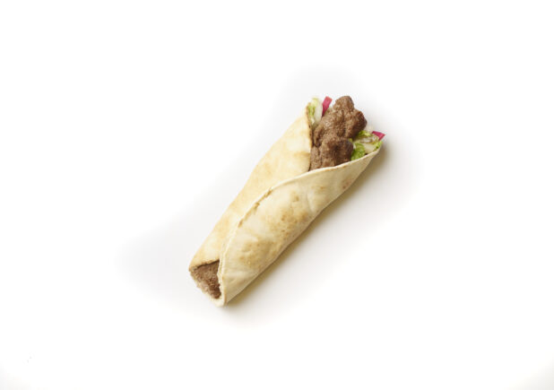 Overhead View of a Beef Kebab Pita Wrap with Fresh Vegetable Toppings, Shot on White for Isolation