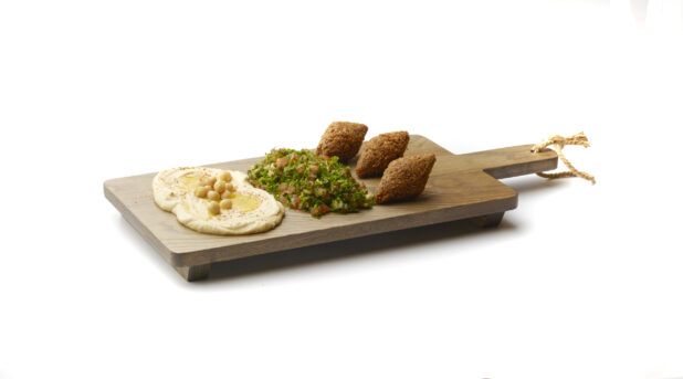 Trio Platter of Side Dishes: Falafel Balls, Tabbouleh and Hummus, on a Wooden Board on a White Background for Isolation