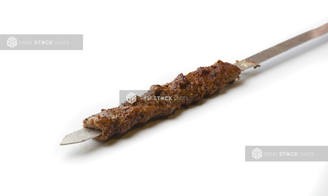 Beef Kebab on a Metal Skewer, on a White Background for Isolation