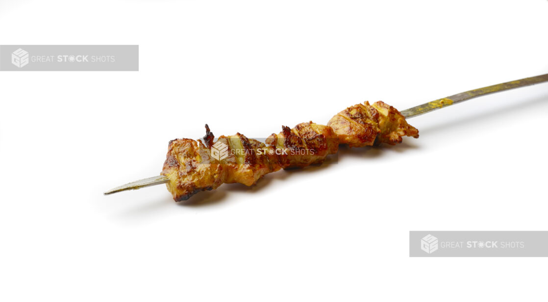 Chicken Kebab on a Metal Skewer, on a White Background for Isolation