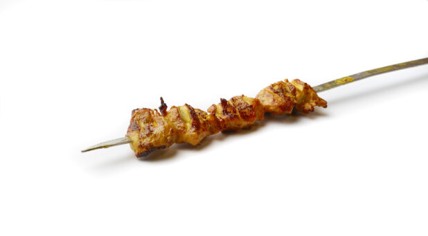 Chicken Kebab on a Metal Skewer, on a White Background for Isolation