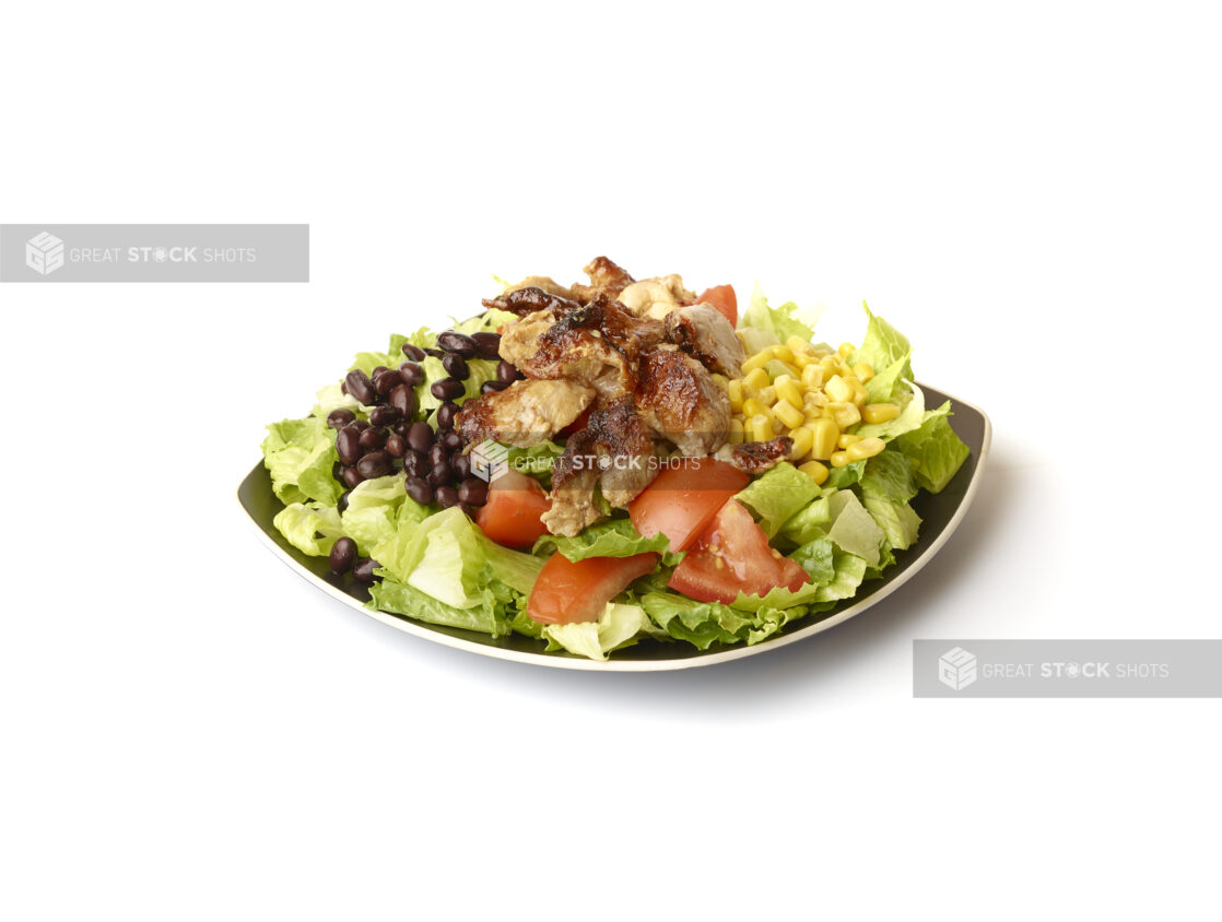 Chicken Shawarma Salad with Corn and Black Beans on a Square Black Ceramic Dish, on a White Background for Isolation - Variation