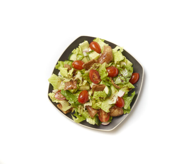 Overhead View of a Garden Salad with Gyro Meat and Balsamic Vinaigrette Drizzle on a Square Black Ceramic Dish, on a White Background for Isolation – Variation 2