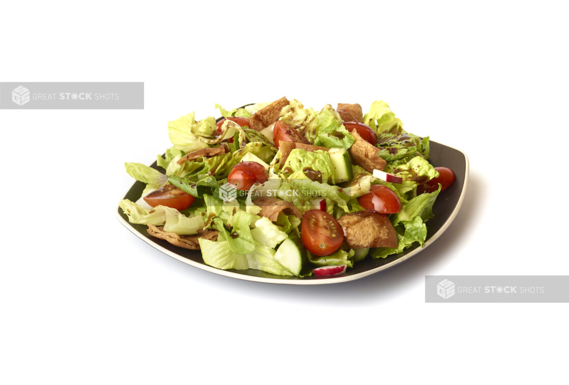 Garden Salad with Gyro Meat and Balsamic Vinaigrette Drizzle on a Square Black Ceramic Dish, on a White Background for Isolation