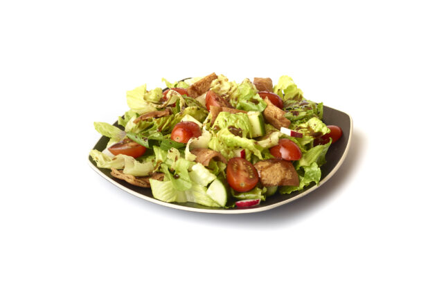 Garden Salad with Gyro Meat and Balsamic Vinaigrette Drizzle on a Square Black Ceramic Dish, on a White Background for Isolation