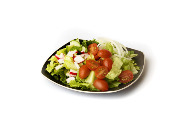 Plain Garden Salad with Cherry Tomatoes, Cucumber, Radishes and White Onions on a Square Black Ceramic Dish, on a White Background for Isolation