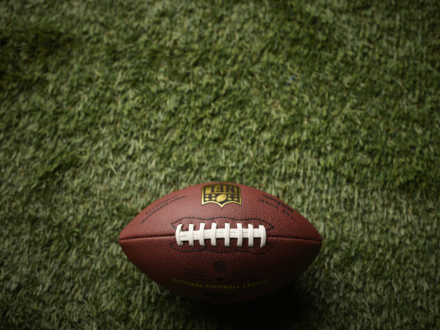 Overhead View of an American Football on Astroturf in an Outdoor Setting