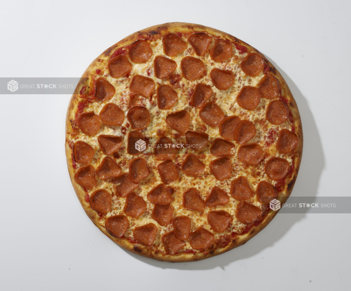 Overhead View of a Whole Pizza with Pepperoni and Cheese Toppings, on a White Background for Isolation