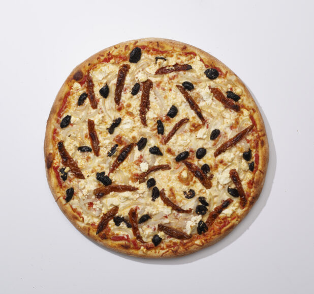 Overhead View of a Whole Specialty Pizza with Sun-dried Tomatoes, Black Olives, White Onions and Feta Cheese, on a White Background for Isolation