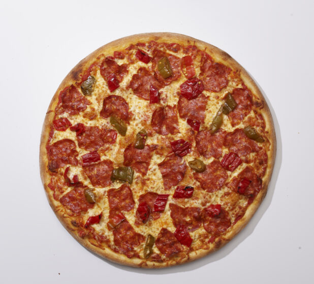 Overhead View of a Whole Specialty Pizza with Spicy Soppressata Salami and Hot Peppers, on a White Background for Isolation