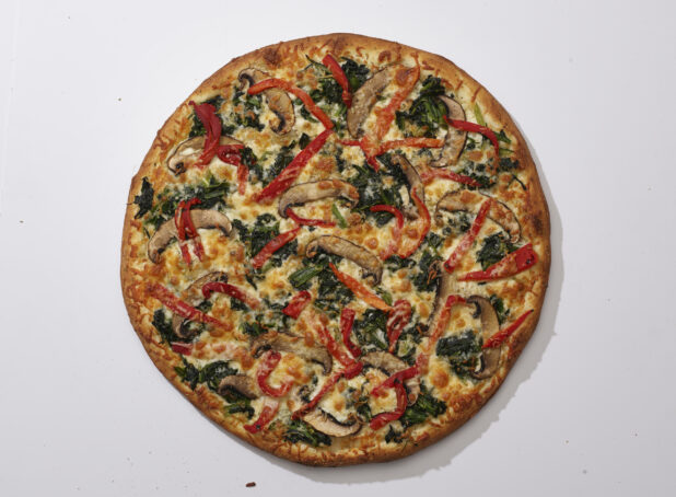 Overhead View of a Whole Specialty Pizza with Portobello Mushrooms, Sautéed Spinach and Roasted Red Peppers, on a White Background for Isolation