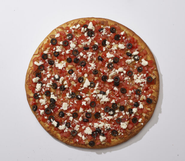 Overhead View of a Whole Specialty Greek Pizza with Black Olives, Feta Cheese, Roasted Garlic and Bruschetta, on a White Background for Isolation