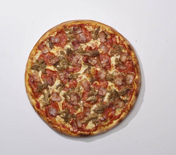 Overhead View of a Whole Specialty Pizza with Porchetta, Spicy Soppressata and Bacon Toppings, on a White Background for Isolation