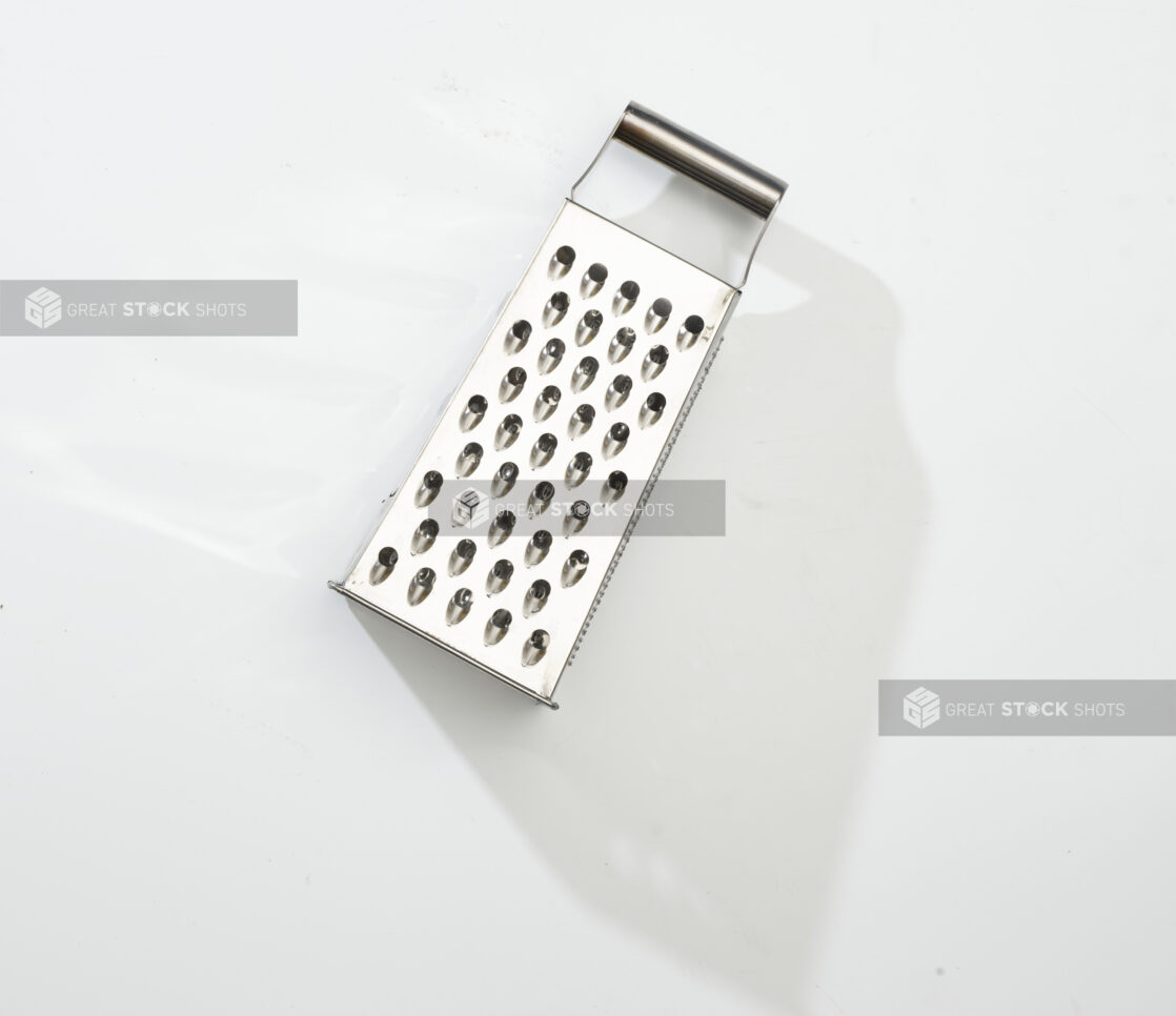 Overhead View of a Stainless Steel Cheese Grater, on a White Background for Isolation