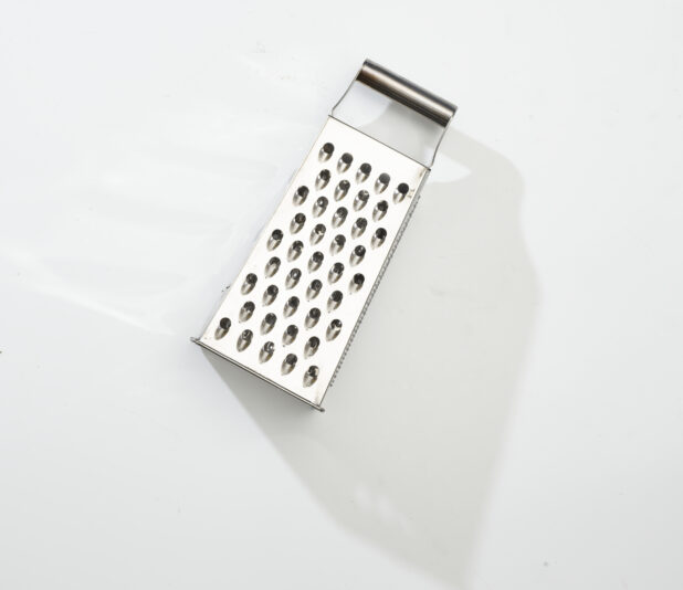 Overhead View of a Stainless Steel Cheese Grater, on a White Background for Isolation