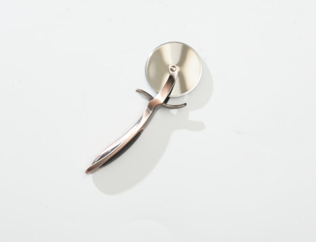 Overhead View of a Pizza Cutter with a Metal Handle, on a White Background for Isolation