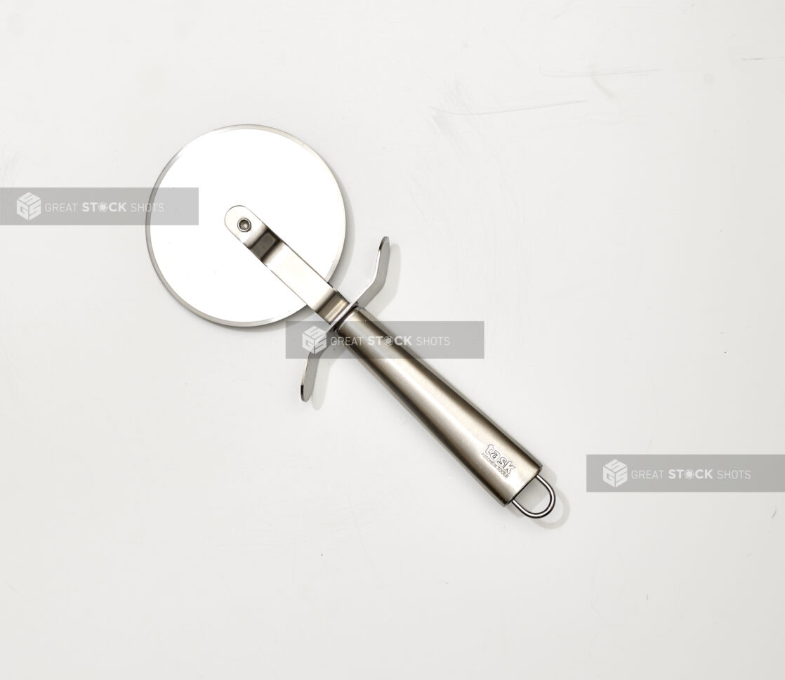 Overhead View of a Pizza Cutter with a Stainless Steel Handle, on a White Background for Isolation - Variation