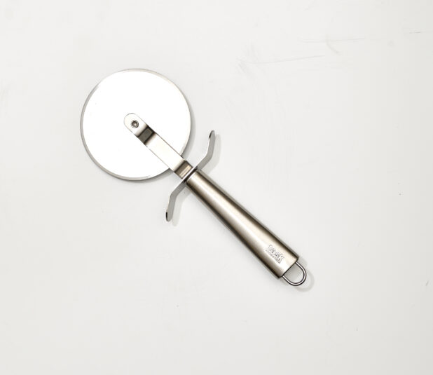 Overhead View of a Pizza Cutter with a Stainless Steel Handle, on a White Background for Isolation - Variation