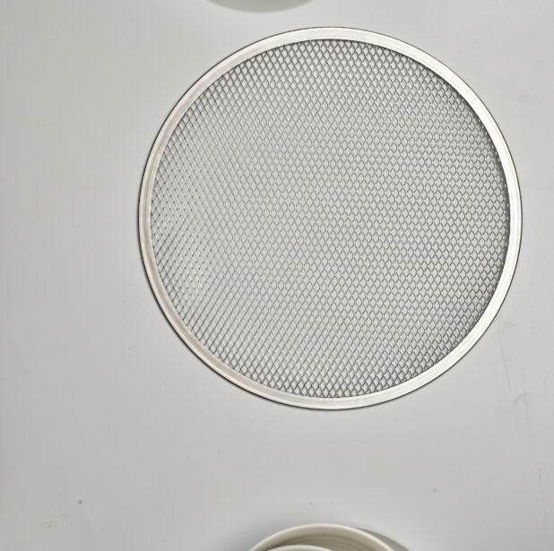 Overhead View of a Round Metal Pizza Screen, on a White Background for Isolation