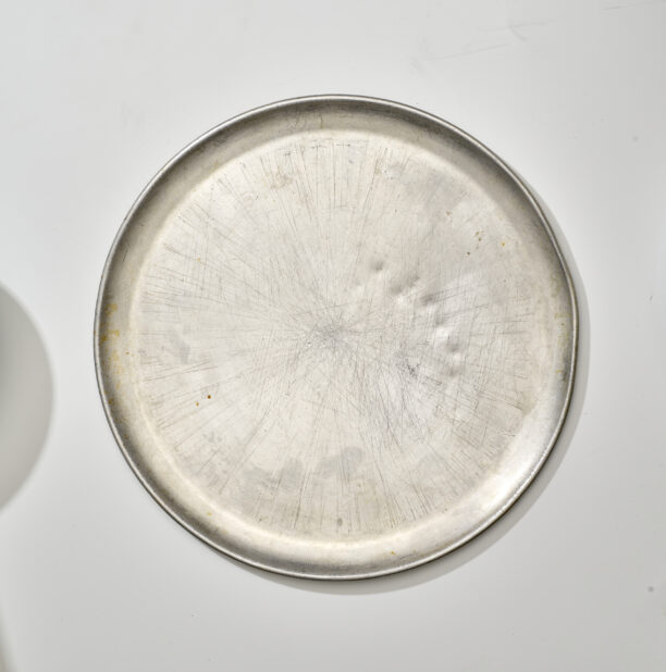 Overhead View of a Well Used Stainless Steel Pizza Tray, on a White Background for Isolation
