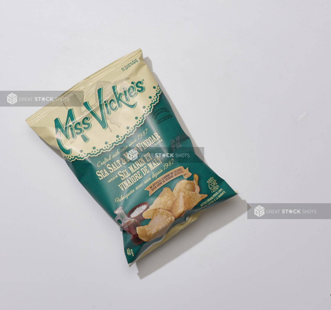 Overhead View of a Small Bag of Miss Vickie's Sea Salt and Malt Vinegar Potato Chips, on a White Background for Isolation