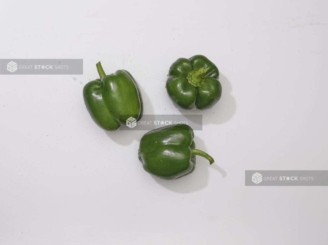 Overhead View of Whole Green Bell Peppers, on a White Background for Isolation