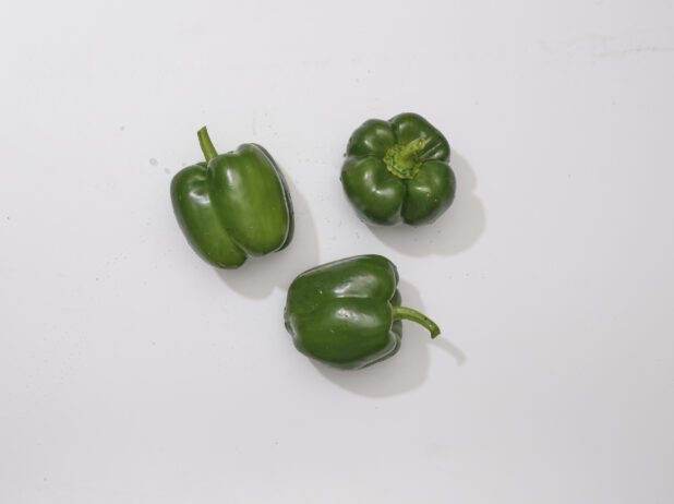 Overhead View of Whole Green Bell Peppers, on a White Background for Isolation