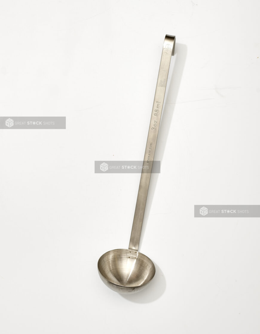 Overhead View of a Stainless Steel Soup Ladle, on a White Background for Isolation - Variation 2