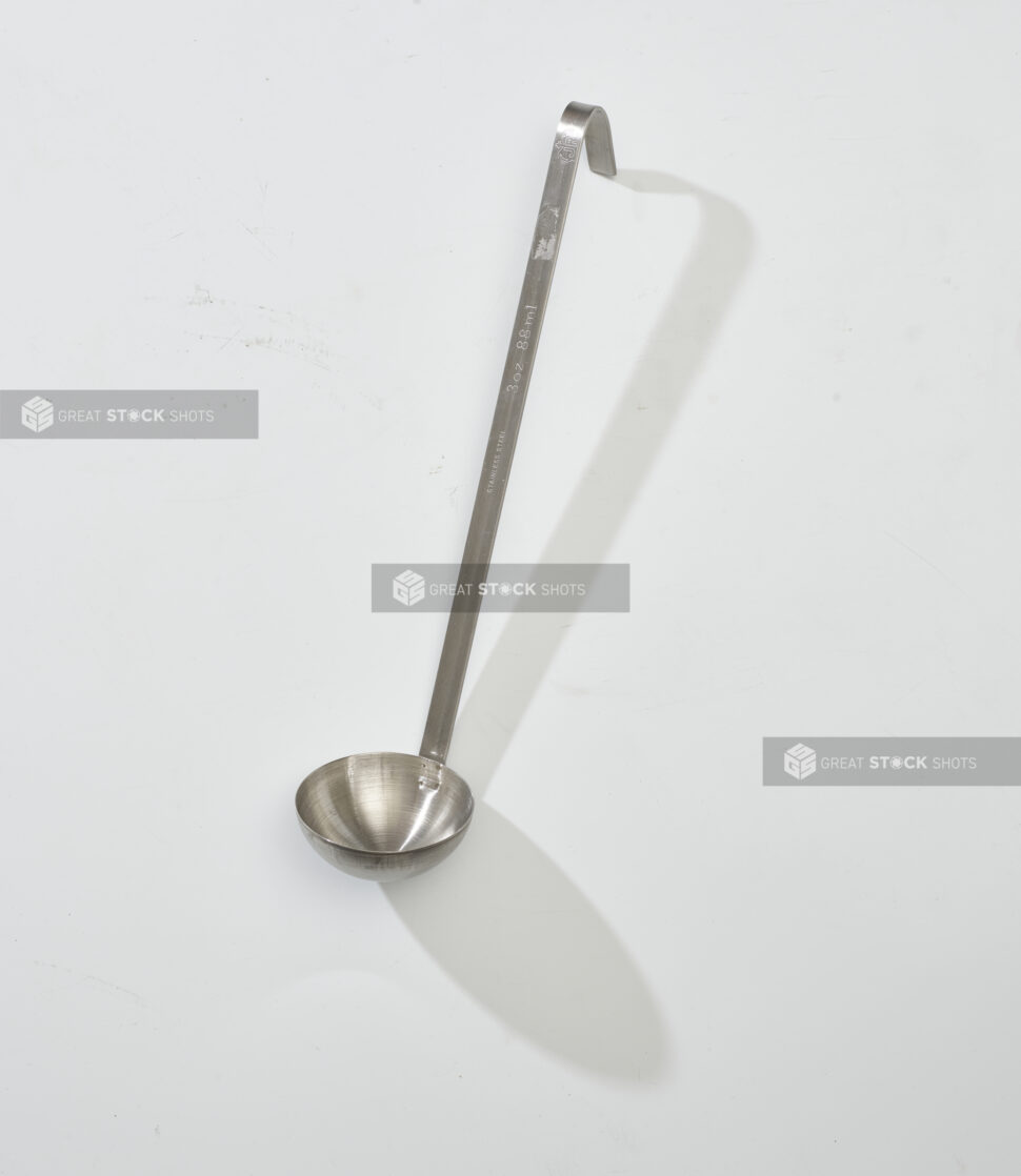 Overhead View of a Stainless Steel Soup Ladle, on a White Background for Isolation - Variation