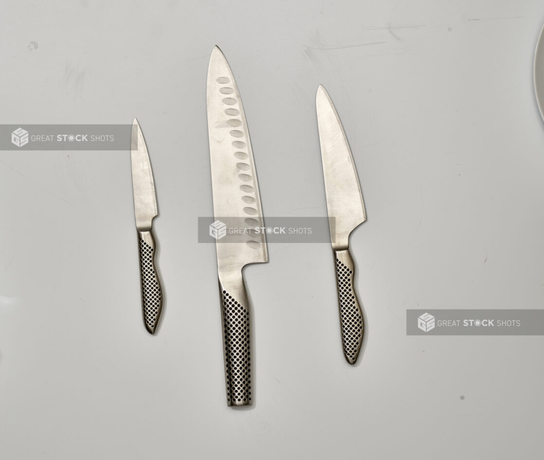 Overhead View of Engineered Steel Kitchen Knives and Paring Knife, on a White Background for Isolation