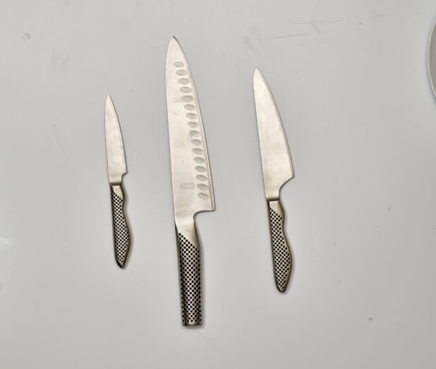 Overhead View of Engineered Steel Kitchen Knives and Paring Knife, on a White Background for Isolation
