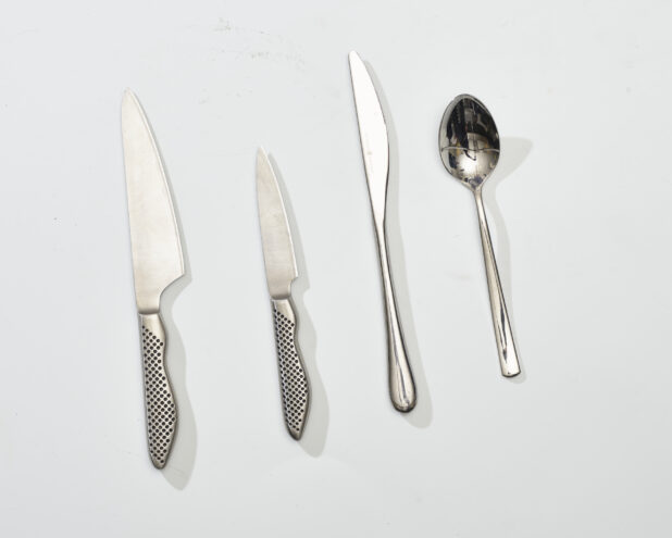 Overhead View of Kitchen Knife, Cheese Knife and Spoon, on a White Background for Isolation