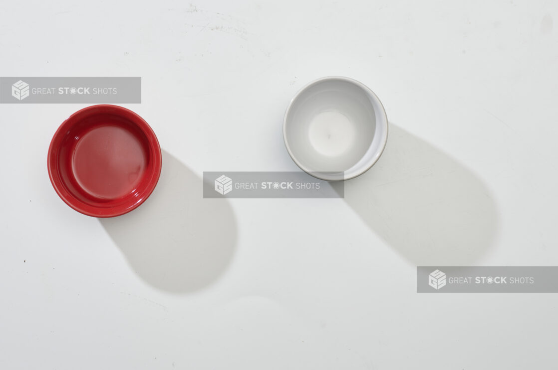 Overhead View of Red and White Round Ceramic Dishes, on a White Background for Isolation