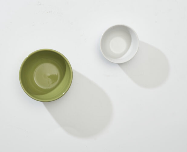 Overhead View of Olive Green and White Round Ceramic Dishes, on a White Background for Isolation