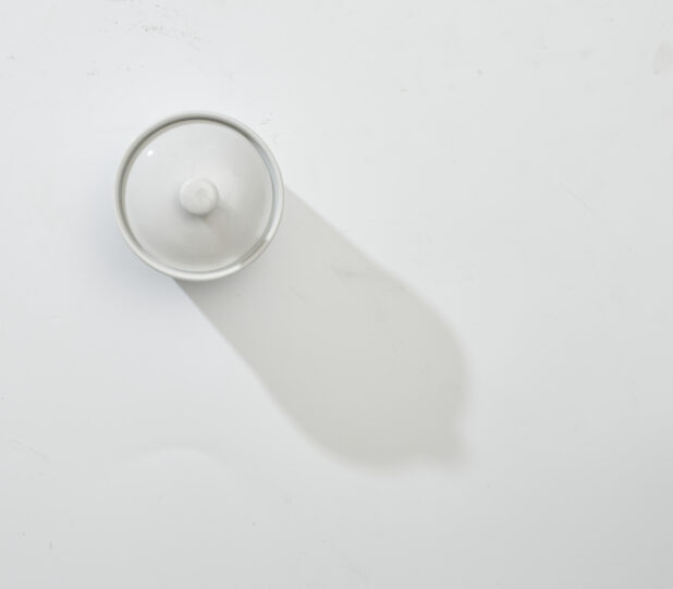 Overhead View of a Covered Round Ceramic Bowl, on a White Background for Isolation