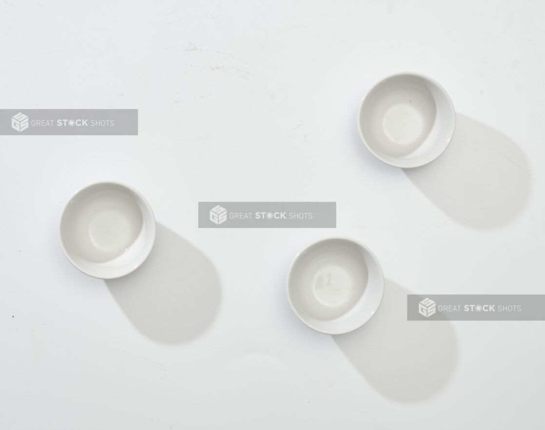 Overhead View of a Trio of White Round Ceramic Dishes, on a White Background for Isolation