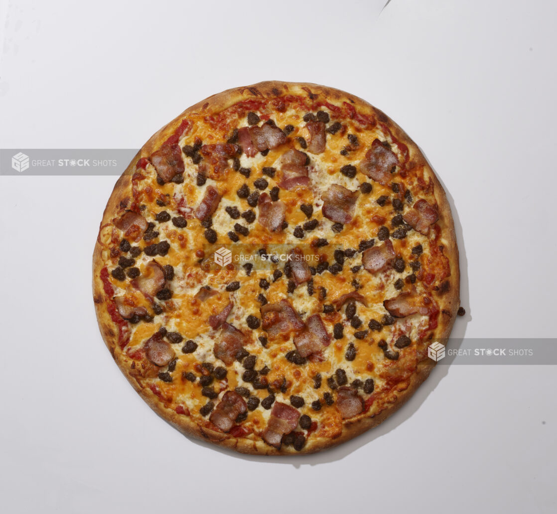 Overhead View of a Whole Pizza with Bacon, Cheddar and Ground Beef, on a White Background for Isolation