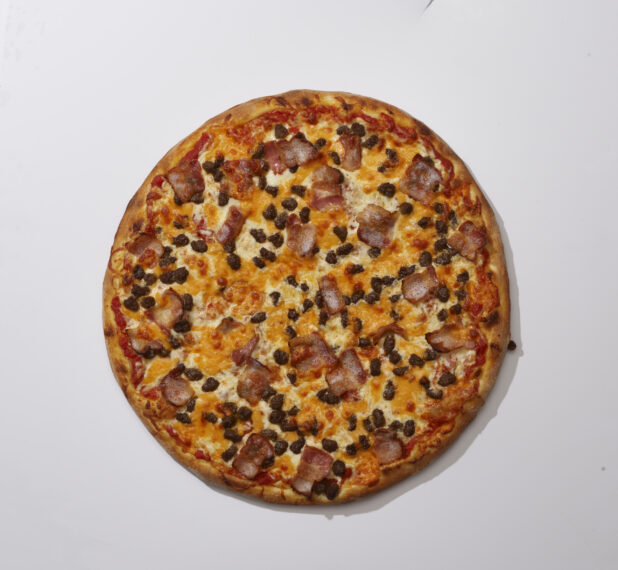 Overhead View of a Whole Pizza with Bacon, Cheddar and Ground Beef, on a White Background for Isolation