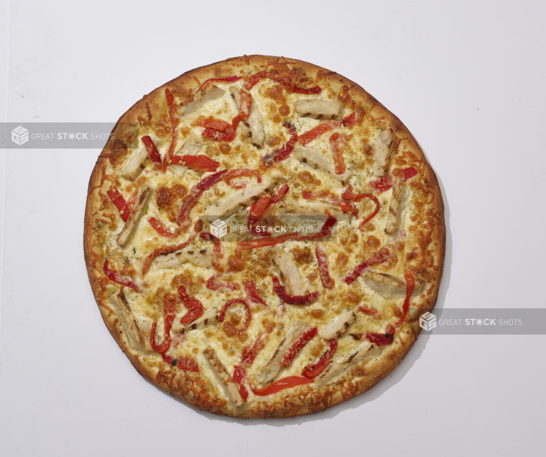 Overhead View of a Whole Specialty Pizza with Roasted Red Pepper, Grilled Chicken and Parmigiano Cheese, on a White Background for Isolation