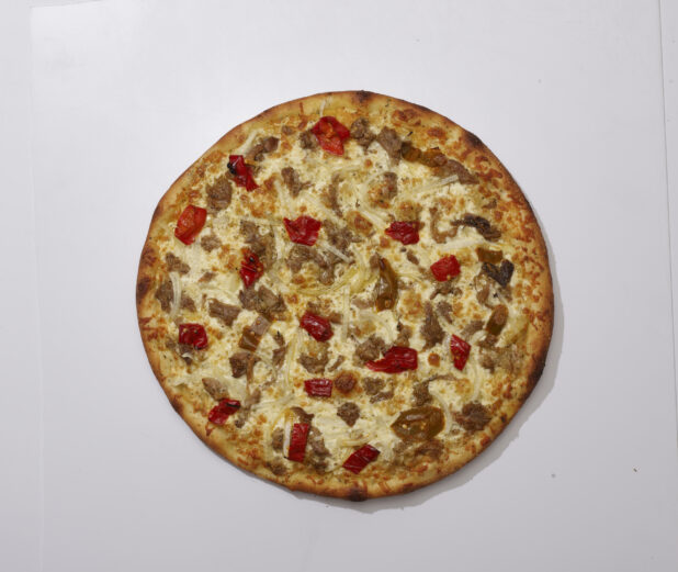 Overhead View of a Whole Specialty Pizza with Porchetta, Hot Peppers and White Onions Toppings, on a White Background for Isolation