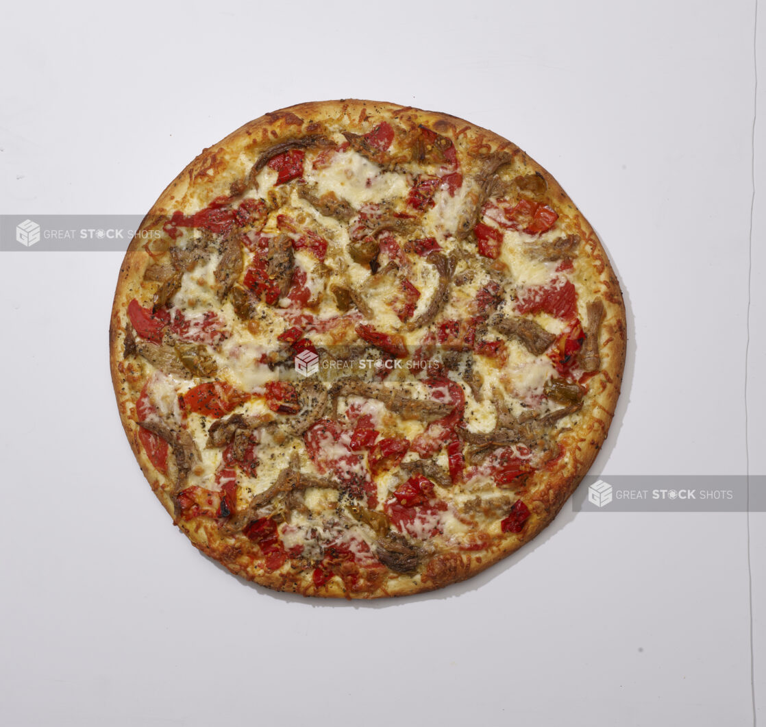 Overhead View of a Whole Specialty Pizza with Porchetta and Hot Banana Peppers Toppings with Cheese on Top, on a White Background for Isolation