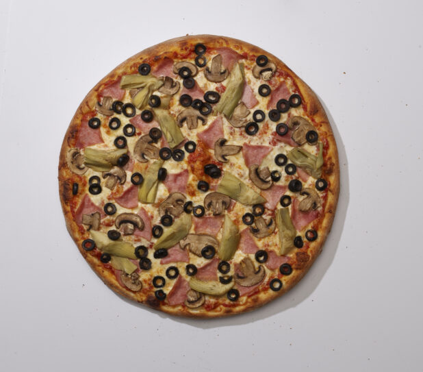 Overhead View of a Whole Specialty Pizza with Ham, Artichoke Hearts, White Mushrooms and Black Olives Toppings, on a White Background for Isolation
