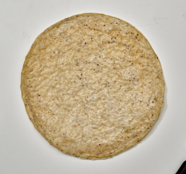 Overhead View of a Gluten-Free Pizza Crust, on a White Background for Isolation