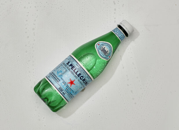 Overhead View of a Plastic Bottle of San Pellegrino Italian Carbonated Mineral Water, on a White Background for Isolation