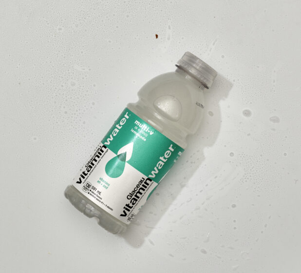 Overhead View of Glaceau VitaminWater Nutrient Enhanced Water in a Plastic Bottle, on a White Background for Isolation - Lemonade