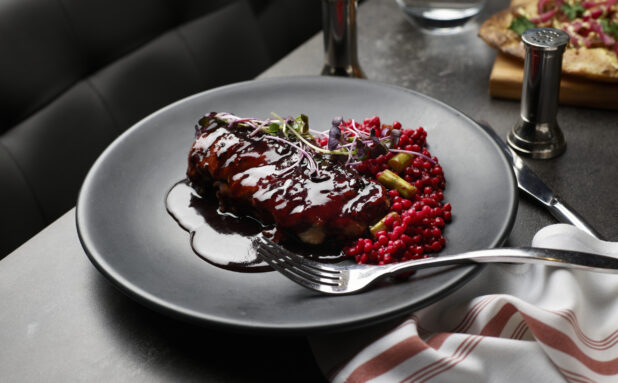 Braised lamb entree with pomegranate and red wine glaze